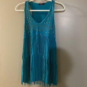 A turquoise designer top by T Party. Size Medium